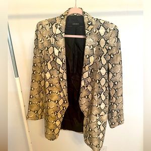 A suit that includes a jacket and skirt pants